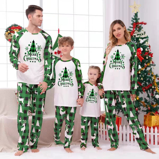 Matching family Christmas pajamas in green and white plaid with deer and Christmas tree graphics. - Image 37