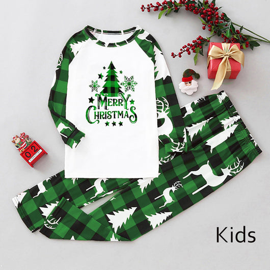 Matching family Christmas pajamas in green and white plaid with deer and Christmas tree graphics. - Image 42