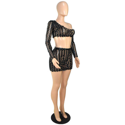 Black net hole hollow-out two-piece set with one-shoulder long-sleeve crop top and matching mini skirt. - Image 66