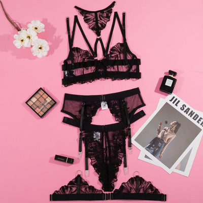 Black mesh and lace lingerie set with embroidered details, including a strappy bra, thong, garter belt, and leg garters. - Image 18