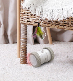 Automatic cat teasing toy with a white roller base and gray wheels, featuring a colorful feather attachment. - Image 23