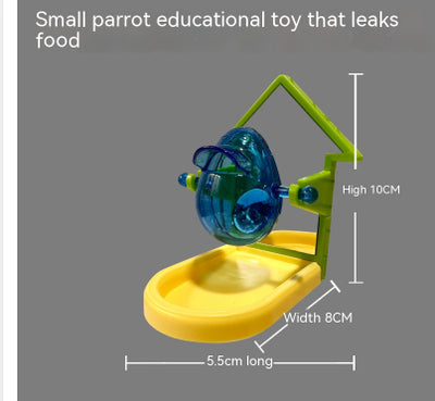 Small blue, yellow, and green parrot food leakage toy with a rotating dispenser and catch tray. - Image 14