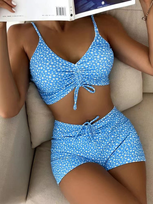 Women's two-piece swimsuit with tropical leaf and floral print. Features a ruched cropped camisole top and high-waisted swim shorts. - Image 12