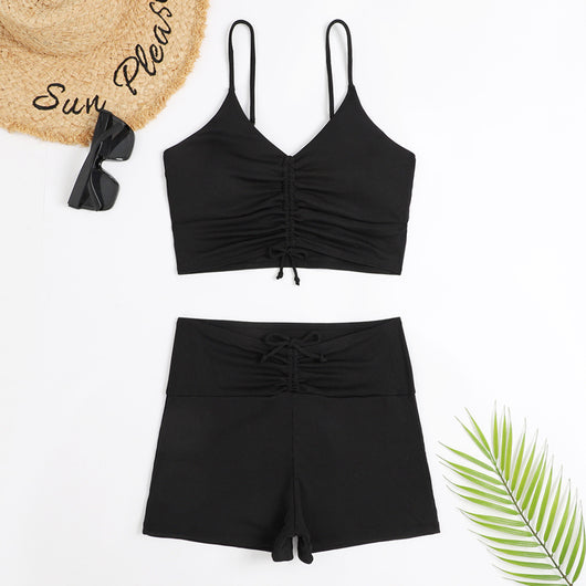 Women's two-piece swimsuit with tropical leaf and floral print. Features a ruched cropped camisole top and high-waisted swim shorts. - Image 13
