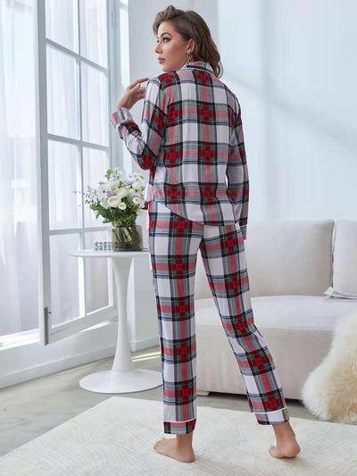 Woman wearing a red, white, and green plaid two-piece pajama set with a button-up top and long pants. - Image 18