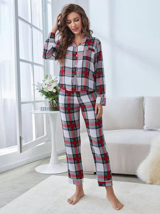 Woman wearing a red, white, and green plaid two-piece pajama set with a button-up top and long pants. - Image 19