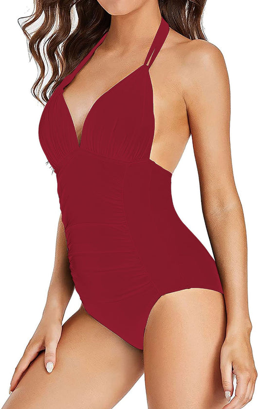 Teal halter one-piece swimsuit with a deep V-neck and ruched detailing on the bodice and sides. - Image 33