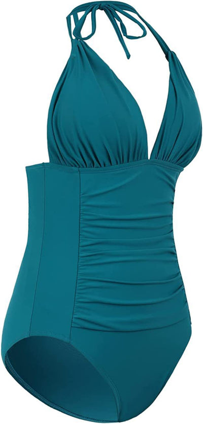 Teal halter one-piece swimsuit with a deep V-neck and ruched detailing on the bodice and sides. - Image 34