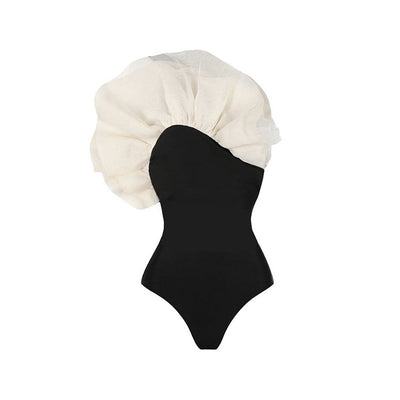 Black one-piece swimsuit with a large 3D flower on one shoulder and a geometric pattern on the bodice. - Image 41