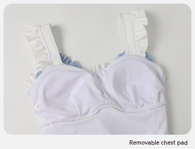 Women's white one-piece swimsuit with light blue lace-up sides, ruffled straps, and pearl-like buttons. - Image 29