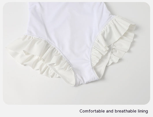 Women's white one-piece swimsuit with light blue lace-up sides, ruffled straps, and pearl-like buttons. - Image 30