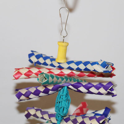 Colorful bird gnawing toy with braided paper strips, shredded paper, and woven balls, hanging from a hook. - Image 15