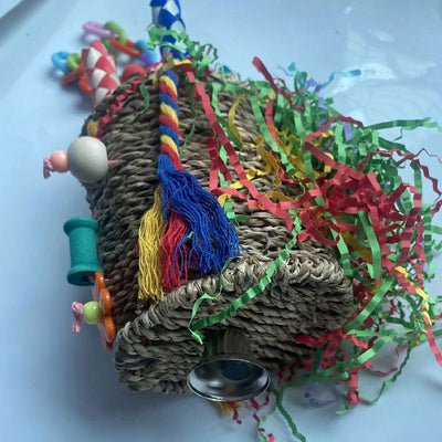 Colorful hanging bird toy with a woven grass basket, wooden beads, paper tubes, and shredded paper for parrots. - Image 8