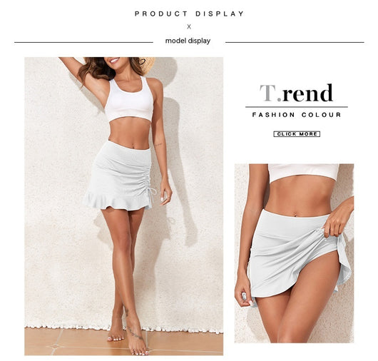 White ribbed high-waisted skort with a pleated skirt overlay, ruched side with drawstrings, and a ruffled hem. - Image 30