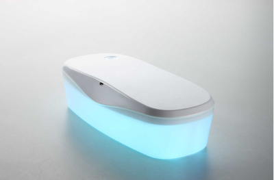 White and grey ultraviolet sterilization box with a glowing blue interior, ideal for sanitizing small items. - Image 10