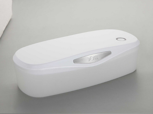 White and grey ultraviolet sterilization box with a glowing blue interior, ideal for sanitizing small items. - Image 11