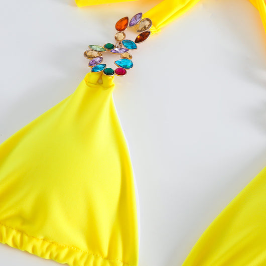 Yellow three-piece swimsuit with a halter bikini top, matching bottoms, and a long mesh skirt, all embellished with colorful rhinestones. - Image 19