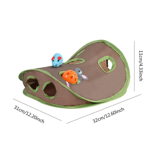 Grey tabby kitten playing with a brown and green hide-and-seek cat toy with multiple holes and a mouse graphic. - Image 7