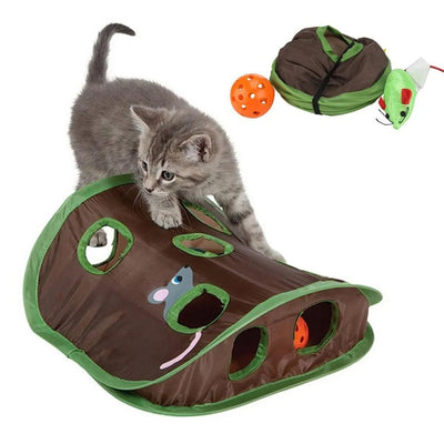 Grey tabby kitten playing with a brown and green hide-and-seek cat toy with multiple holes and a mouse graphic. - Image 8
