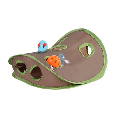Grey tabby kitten playing with a brown and green hide-and-seek cat toy with multiple holes and a mouse graphic. - Image 10