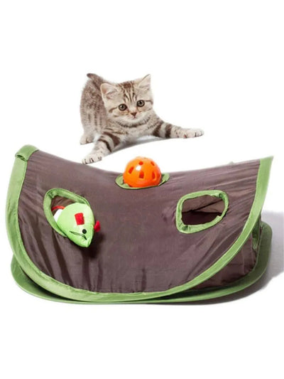 Grey tabby kitten playing with a brown and green hide-and-seek cat toy with multiple holes and a mouse graphic. - Image 16