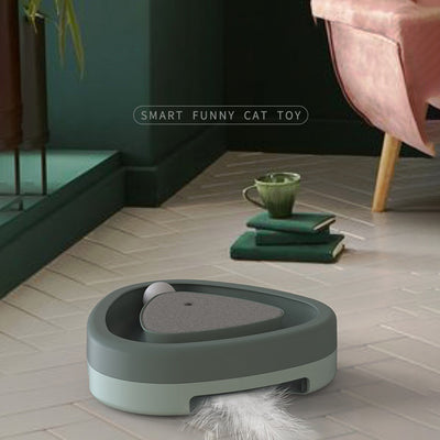 Two-tone green and grey triangle electric cat toy with a rotating feather wand and a ball track on a tiled floor. - Image 9