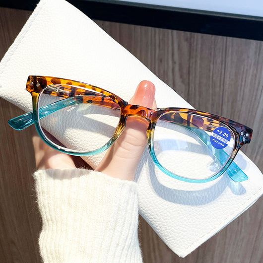 Women's retro leopard print presbyopic glasses with anti-blue light clear lenses and a blue gradient bottom frame. - Image 16
