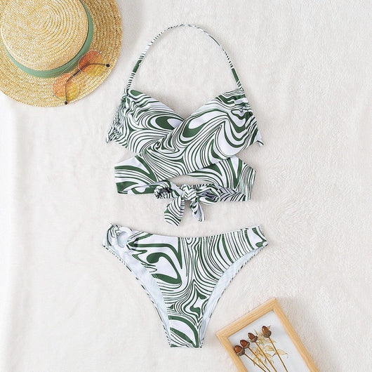 Green and white abstract swirl print halter bikini with a cross-front top and high-cut bottoms with an O-ring. - Image 12
