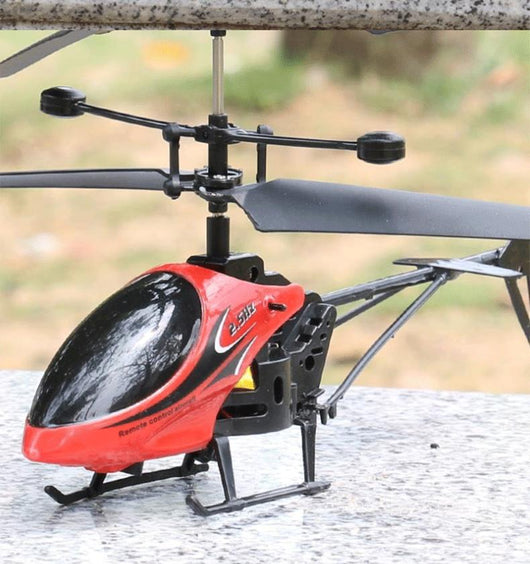 Light blue and black mini remote control helicopter with '2.5HZ' text, dual rotors, and landing skid. - Image 12