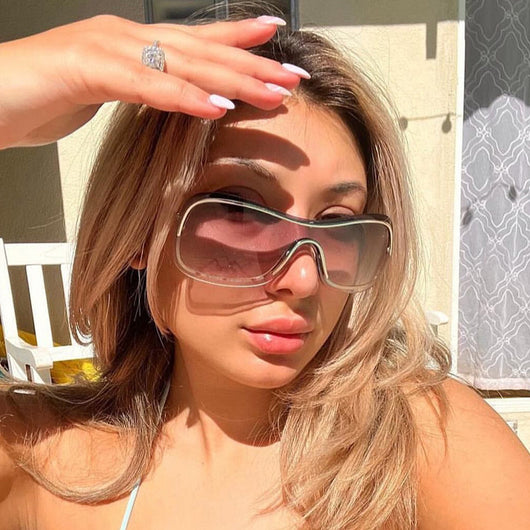 Women's fashionable shield sunglasses with a gold metal frame and dark gray lenses, featuring a unique wavy design. - Image 22