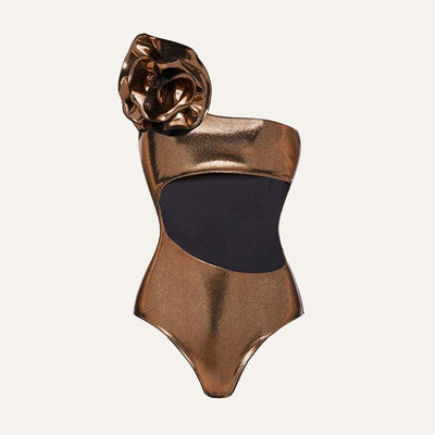Metallic bronze one-piece swimsuit with a one-shoulder design, large decorative flower, and side cut-out revealing a black panel. - Image 17