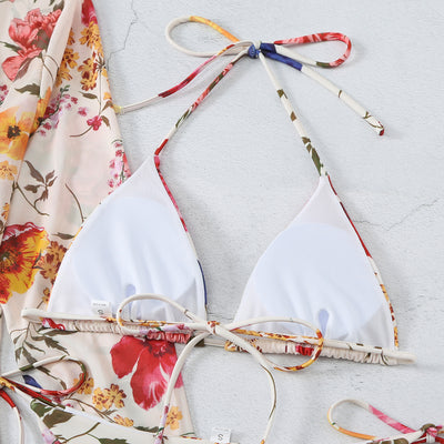 Milky white floral print three-piece swimsuit with triangle bikini top, v-cut bottom, and sheer long-sleeve cover-up. - Image 69