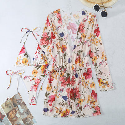 Milky white floral print three-piece swimsuit with triangle bikini top, v-cut bottom, and sheer long-sleeve cover-up. - Image 88