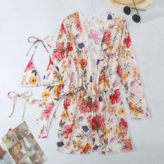 Milky white floral print three-piece swimsuit with triangle bikini top, v-cut bottom, and sheer long-sleeve cover-up. - Image 88