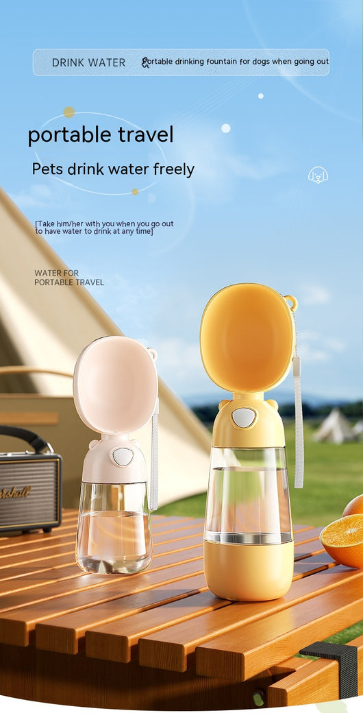 Yellow portable pet water bottle with clear reservoir, built-in drinking bowl, and wrist strap, 28cm tall. - Image 16