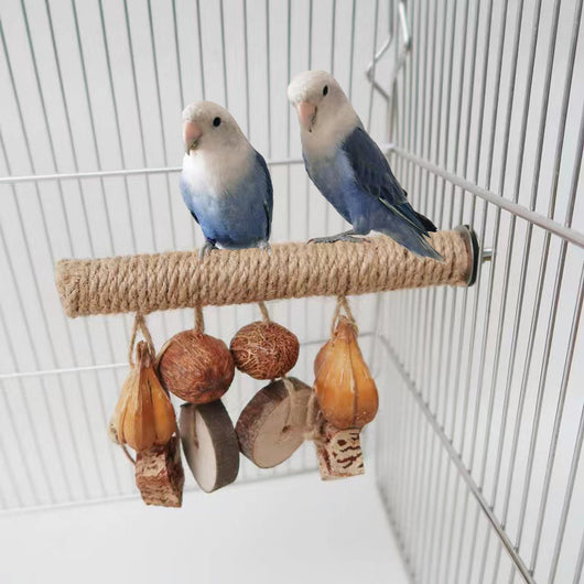 Hemp rope braided bird perch with natural wood slices and seed pods hanging, attached inside a wire bird cage. - Image 9