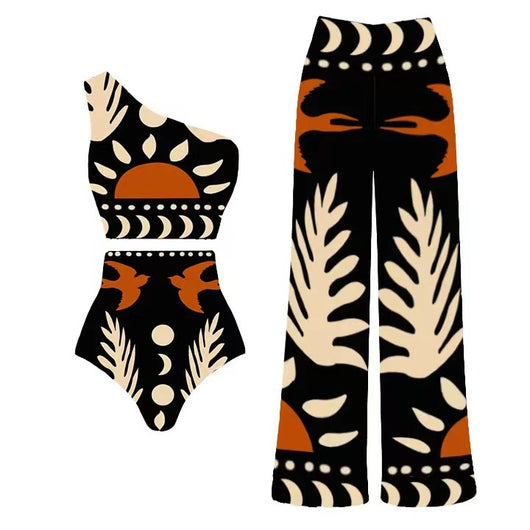 Black one-piece swimsuit with an asymmetrical top and matching long skirt, featuring a tropical palm tree and bird print. - Image 34