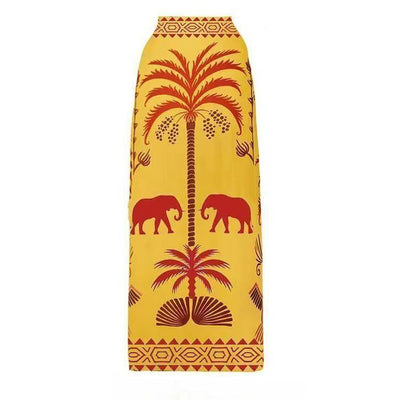Black one-piece swimsuit with an asymmetrical top and matching long skirt, featuring a tropical palm tree and bird print. - Image 35