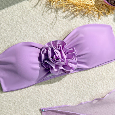 Women's blue tube top swimsuit with a large 3D flower, tie-side bikini bottoms, and a sheer sarong skirt. - Image 14