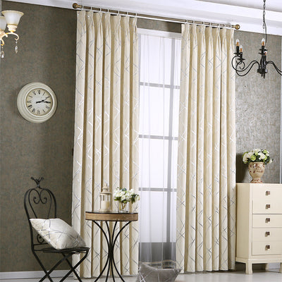 Gray chenille blackout curtains with a subtle silver geometric pattern, hung on a gold rod in a modern living room. - Image 11