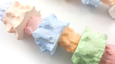 Colorful pepper stone molar string toy for birds, featuring pastel blocks and a metal bell at the bottom. - Image 9