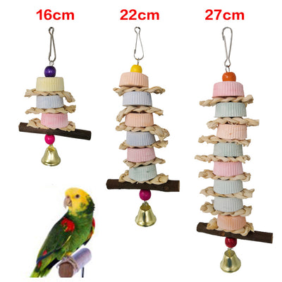 Colorful bird toy with stacked ridged blocks, natural straw, a wooden perch, and a golden bell, hanging from a metal clip. - Image 8