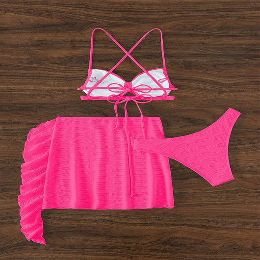 Hot pink lace-up bikini three-piece swimsuit with textured fabric and ruffled sheer cover-up skirt. - Image 10