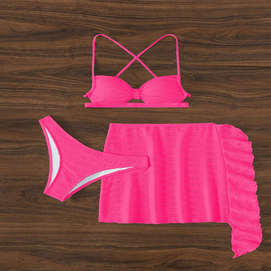 Hot pink lace-up bikini three-piece swimsuit with textured fabric and ruffled sheer cover-up skirt. - Image 16