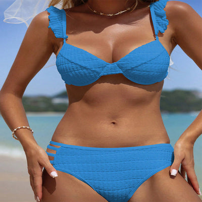 Green ruffled bikini with textured fabric and triangle top, modeled on a sunny beach. - Image 27