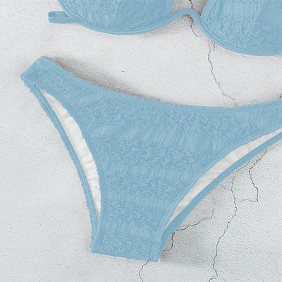 Woman in a white halter lace-up bikini with textured fabric, U-wire top, and high-cut bottom by a pool. - Image 13