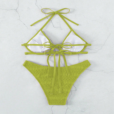 Woman in a white halter lace-up bikini with textured fabric, U-wire top, and high-cut bottom by a pool. - Image 23