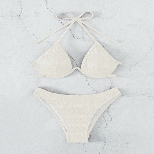 Woman in a white halter lace-up bikini with textured fabric, U-wire top, and high-cut bottom by a pool. - Image 24
