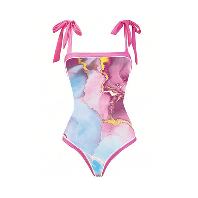 Women's one-piece swimsuit and matching sarong with a pink, blue, and gold marble print. Features tie-shoulder straps. - Image 12
