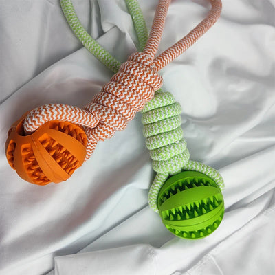 Blue and white braided rope dog toy with a teal rubber treat-dispensing ball for chewing and teeth cleaning. - Image 19